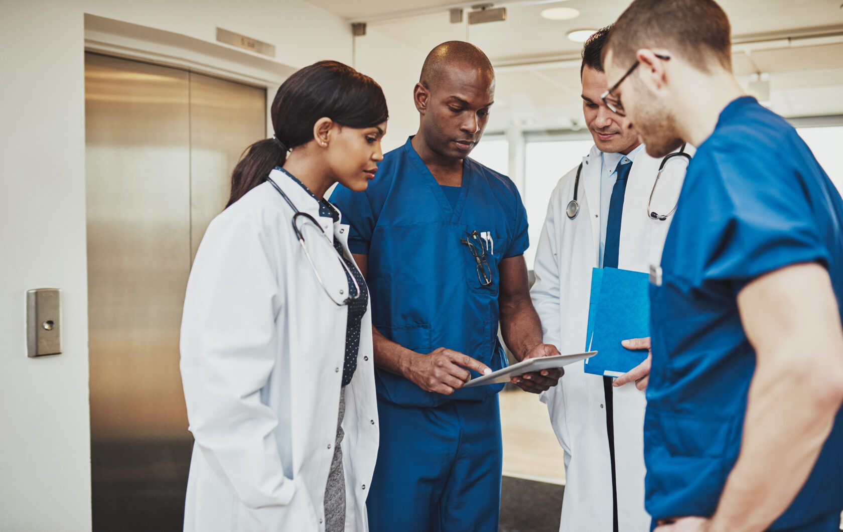 Black surgeon giving instruction to medical team