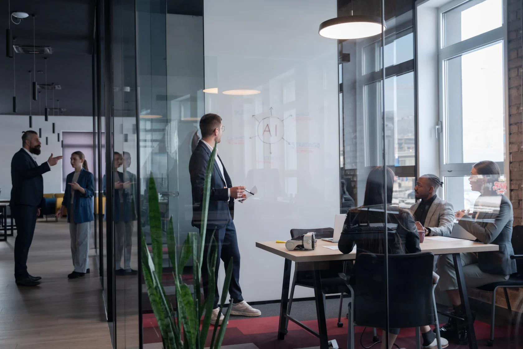Modern office meeting with diverse professionals discussing artificial intelligence strategy Concept of teamwork, technology, and corporate innovation in a contemporary workspace
